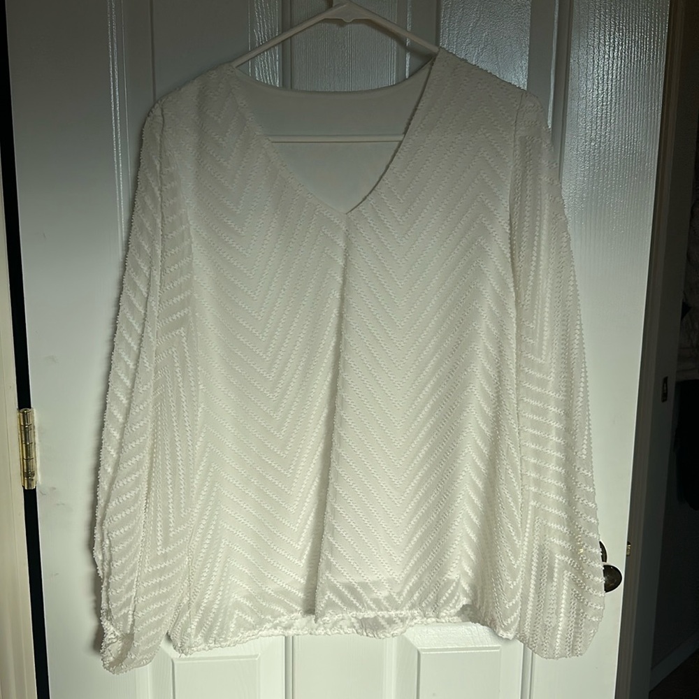 White blouse long sleeve with details. Sheer arms.